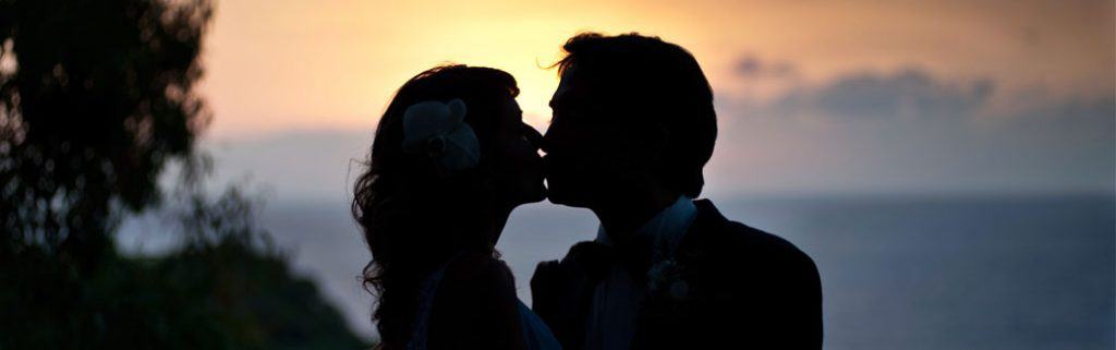 silhouette of a husband and wife kissing