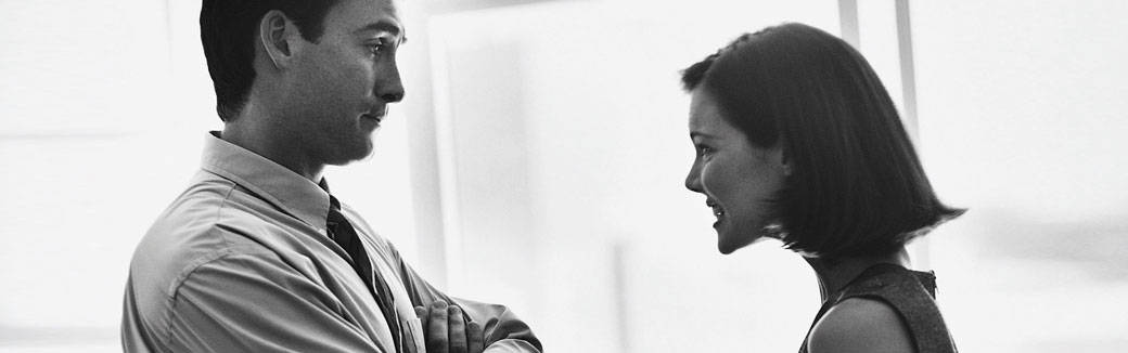 black & white photo of a couple arguing.